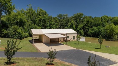 Custom steel-frame home with guest quarters, shop, pool, pond & - photo 36