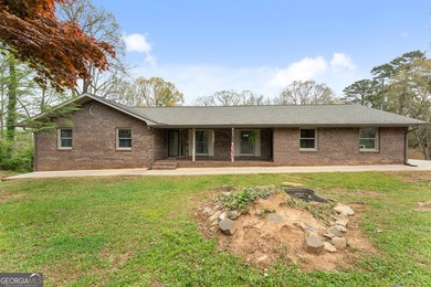 Well-kept and ready to go, this solid brick home offers comfort - photo 1