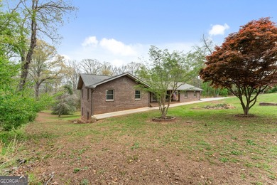 Well-kept and ready to go, this solid brick home offers comfort - photo 8