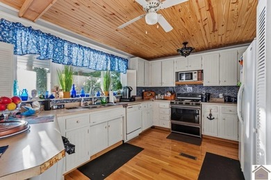 Experience waterfront living at its finest with this freshly - photo 8
