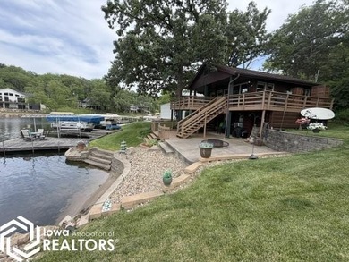Tucked inside a quiet no-wake cove with stunning views of the - photo 3