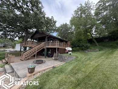 Tucked inside a quiet no-wake cove with stunning views of the - photo 4