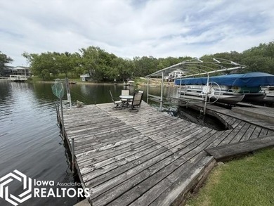 Tucked inside a quiet no-wake cove with stunning views of the - photo 10
