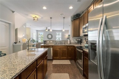 Welcome home to this well-maintained tri-level townhome in the - photo 8