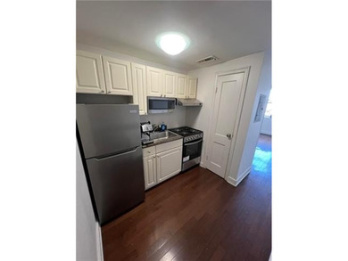 Live on iconic St. Charles Avenue in this well-located