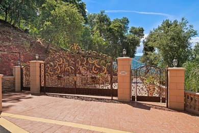 Welcome to an exquisite Mediterranean estate nestled in the - photo 3