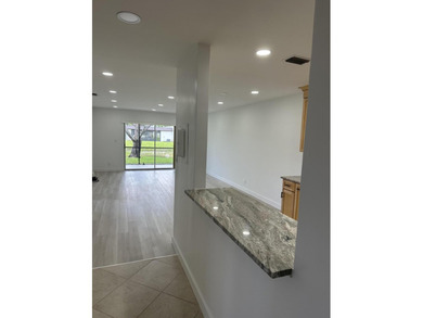 Completely renovated and move-in ready, this stunning villa - photo 7