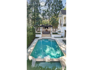 This extraordinary estate in the prestigious Windward community