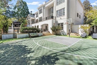 This extraordinary estate in the prestigious Windward community