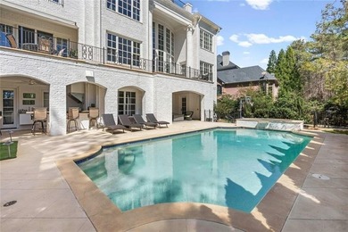 This extraordinary estate in the prestigious Windward community