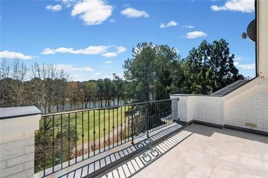 This extraordinary estate in the prestigious Windward community