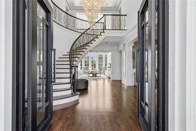 This extraordinary estate in the prestigious Windward community