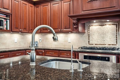 Tucked inside the gated Pebble Bay community, this custom-built - photo 12