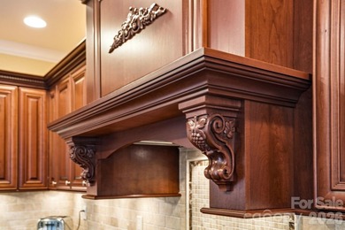Tucked inside the gated Pebble Bay community, this custom-built - photo 16
