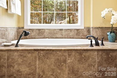 Tucked inside the gated Pebble Bay community, this custom-built - photo 27