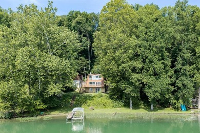 This four-bedroom, two-bath, 2,116-square-foot two-story cabin - photo 3