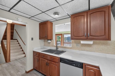 This four-bedroom, two-bath, 2,116-square-foot two-story cabin - photo 10
