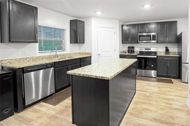 Welcome to effortless living in a serene Hampton neighborhood