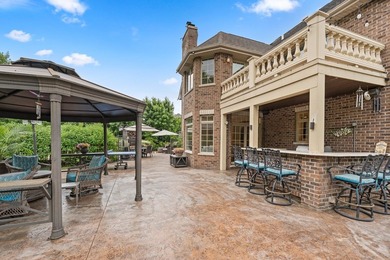 Nestled on a breathtaking lot, this CUSTOM home offers luxurious - photo 14