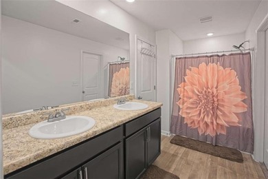 Welcome to effortless living in a serene Hampton neighborhood