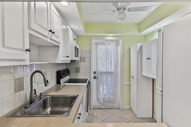 LOVELY EAST FACING UPDATED 2/2 second floor garden view unit in - photo 19