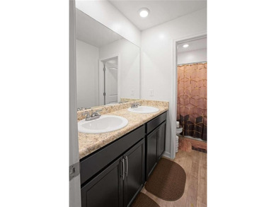 Welcome to effortless living in a serene Hampton neighborhood