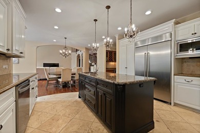 Nestled on a breathtaking lot, this CUSTOM home offers luxurious - photo 26