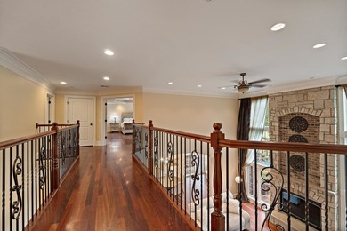 Nestled on a breathtaking lot, this CUSTOM home offers luxurious - photo 29