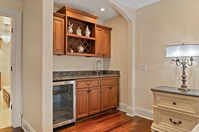 Nestled on a breathtaking lot, this CUSTOM home offers luxurious - photo 33