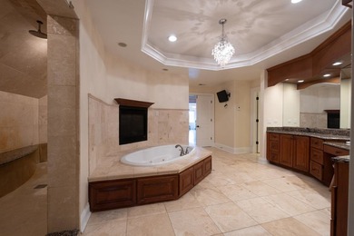 Nestled on a breathtaking lot, this CUSTOM home offers luxurious - photo 36