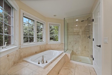 Nestled on a breathtaking lot, this CUSTOM home offers luxurious - photo 43