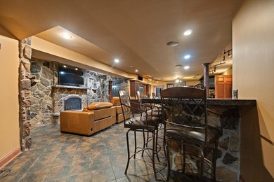 Nestled on a breathtaking lot, this CUSTOM home offers luxurious - photo 47