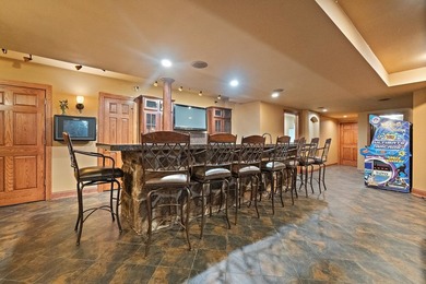 Nestled on a breathtaking lot, this CUSTOM home offers luxurious - photo 49