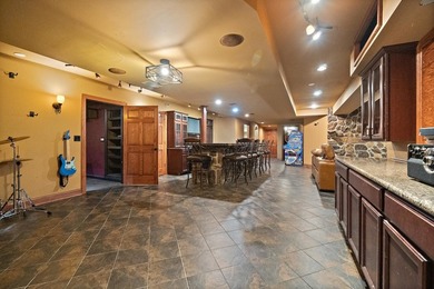 Nestled on a breathtaking lot, this CUSTOM home offers luxurious - photo 50