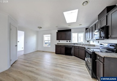 Tastefully updated and move-in ready, this bright home features