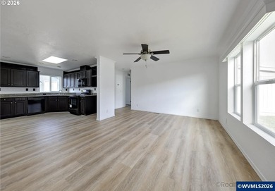 Tastefully updated and move-in ready, this bright home features