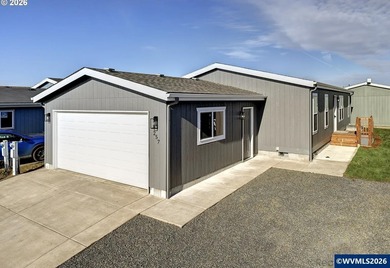 Tastefully updated and move-in ready, this bright home features