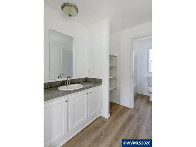 Tastefully updated and move-in ready, this bright home features