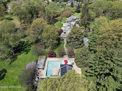 Beyond private gates, a tree-lined drive reveals Turtle Pond - photo 38