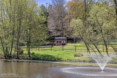 Beyond private gates, a tree-lined drive reveals Turtle Pond - photo 46