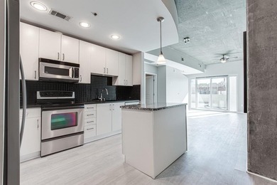 This unique condo offers open-concept living with direct access