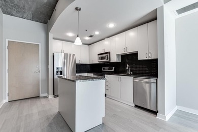 This unique condo offers open-concept living with direct access