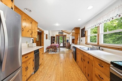 Located on Long Lake in Harrison, Maine, this exceptional - photo 12