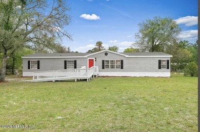 This gorgeous 5 bedroom, 3 full bath home is located an acre! In - photo 1