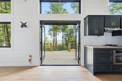Perched on 1.12 private acres, this custom-built Timbercraft - photo 13