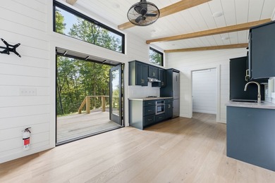 Perched on 1.12 private acres, this custom-built Timbercraft - photo 14