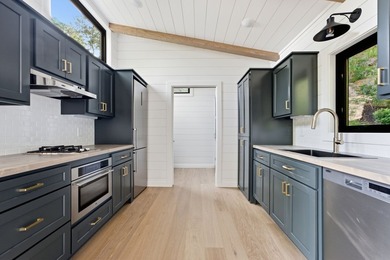 Perched on 1.12 private acres, this custom-built Timbercraft - photo 16