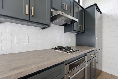 Perched on 1.12 private acres, this custom-built Timbercraft - photo 17