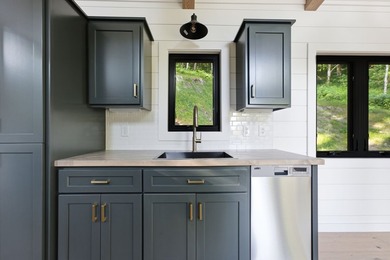 Perched on 1.12 private acres, this custom-built Timbercraft - photo 20