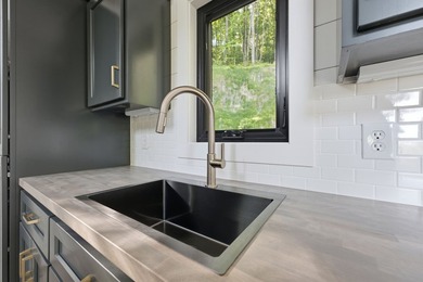 Perched on 1.12 private acres, this custom-built Timbercraft - photo 21